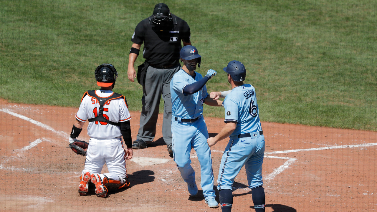 Randal Grichuk runs to first during the game between