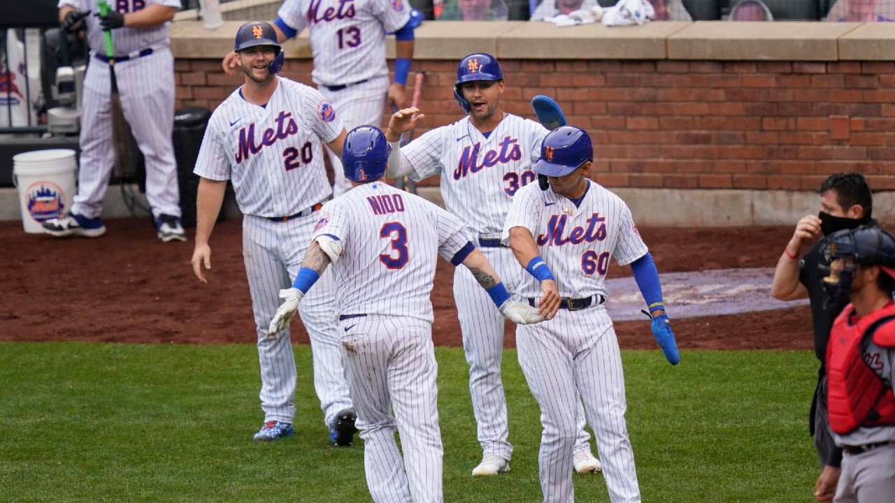 New York Mets catcher Paul Lo Duca cuts off the throw and looks to