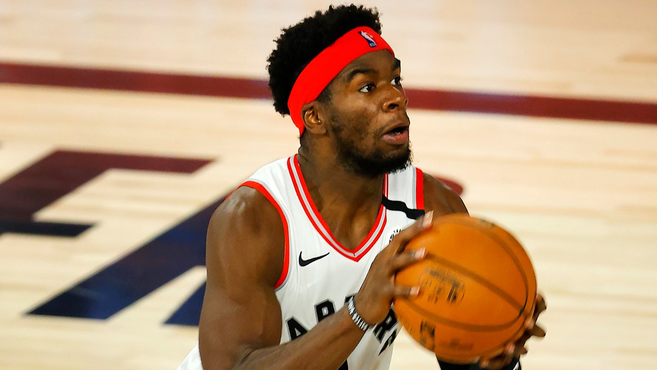 Toronto Raptors' Terence Davis (0) handles the ball during the third quarter against the Denver Nuggets in an NBA basketball game. (Mike Ehrmann/Pool Photo via AP)