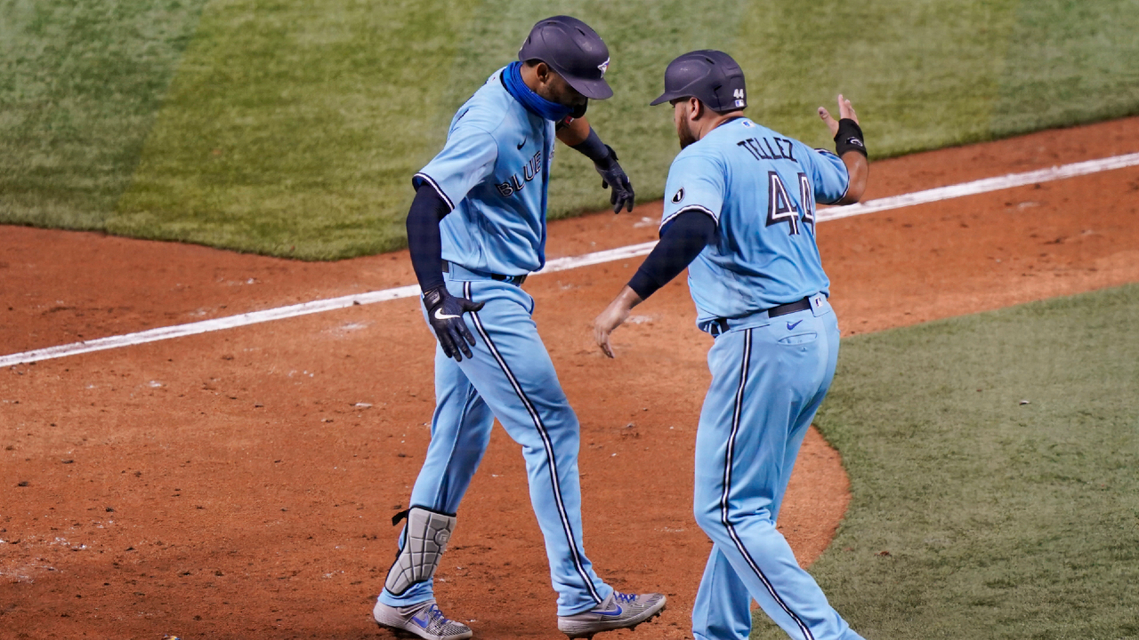 Toronto Blue Jays' Lourdes Gurriel Jr., left, and Rowdy Tellez (44) celebrate after Gurriel hit a home run that scored Tellez during the fifth inning against the Miami Marlins, Wednesday, Sept. 2, 2020, in Miami. (Wilfredo Lee/AP)