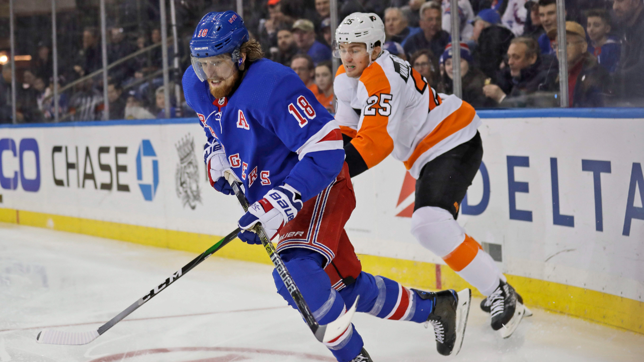 New York Rangers' Marc Staal, left, and Philadelphia Flyers' James van Riemsdyk compete for the puck during the third period of the NHL hockey game, Sunday, March 1, 2020, in New York. The Flyers defeated the Rangers 5-3. (Seth Wenig/AP)
