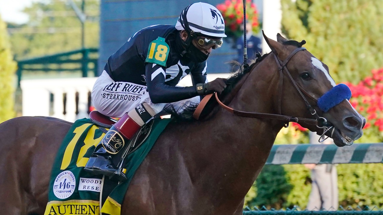 In this Saturday, Sept. 5, 2020, file photo, Authentic, ridden by jockey John Velazquez, heads to the finish line to win the 146th running of the Kentucky Derby. (Darron Cummings, File, AP)