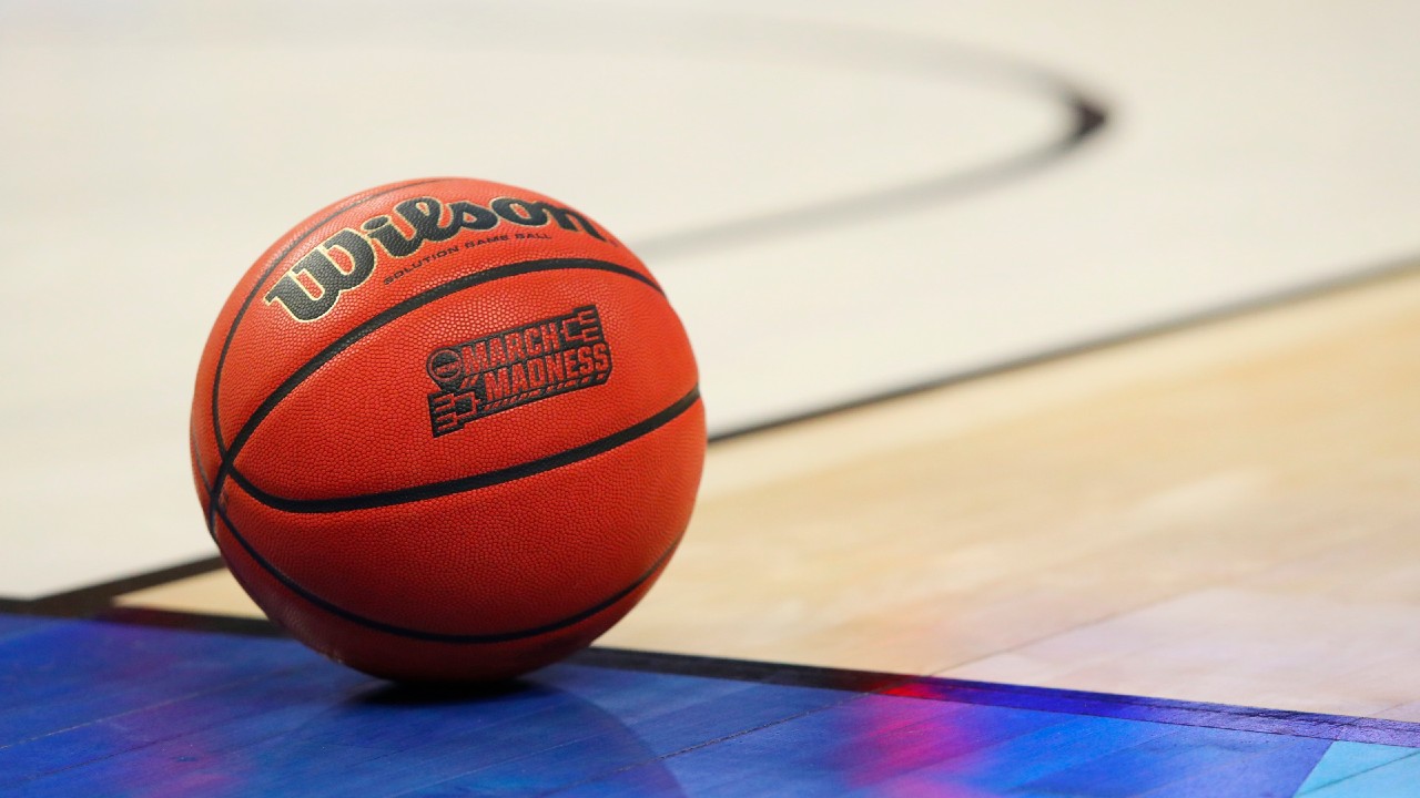 In this March 18, 2017, file photo, an official game ball with the March Madness logo sits in the court during a second-round men's college basketball game between Villanova and Wisconsin in the NCAA Tournament in Buffalo, N.Y. (Bill Wippert/AP)