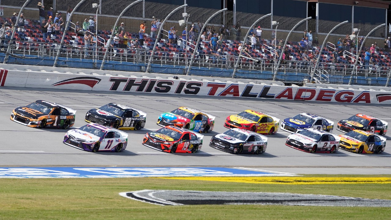 Denny Hamlin (11) and Kurt Busch (1) lead the field to the start of the YellaWood 500 NASCAR auto race at Talladega Superspeedway, Sunday, Oct. 4, 2020, in Talladega, Ala. (John Bazemore/AP)