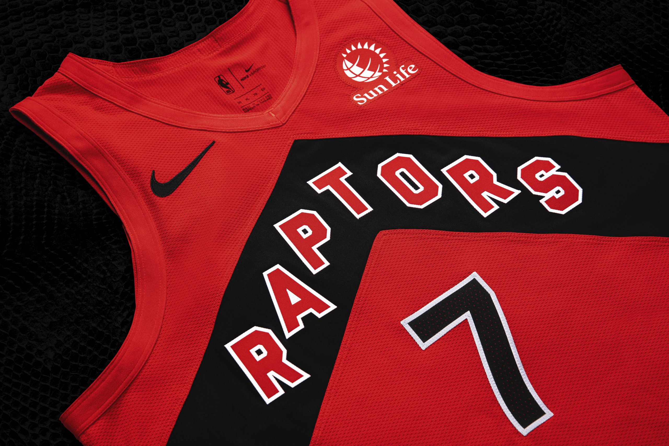 purple and red raptors jersey