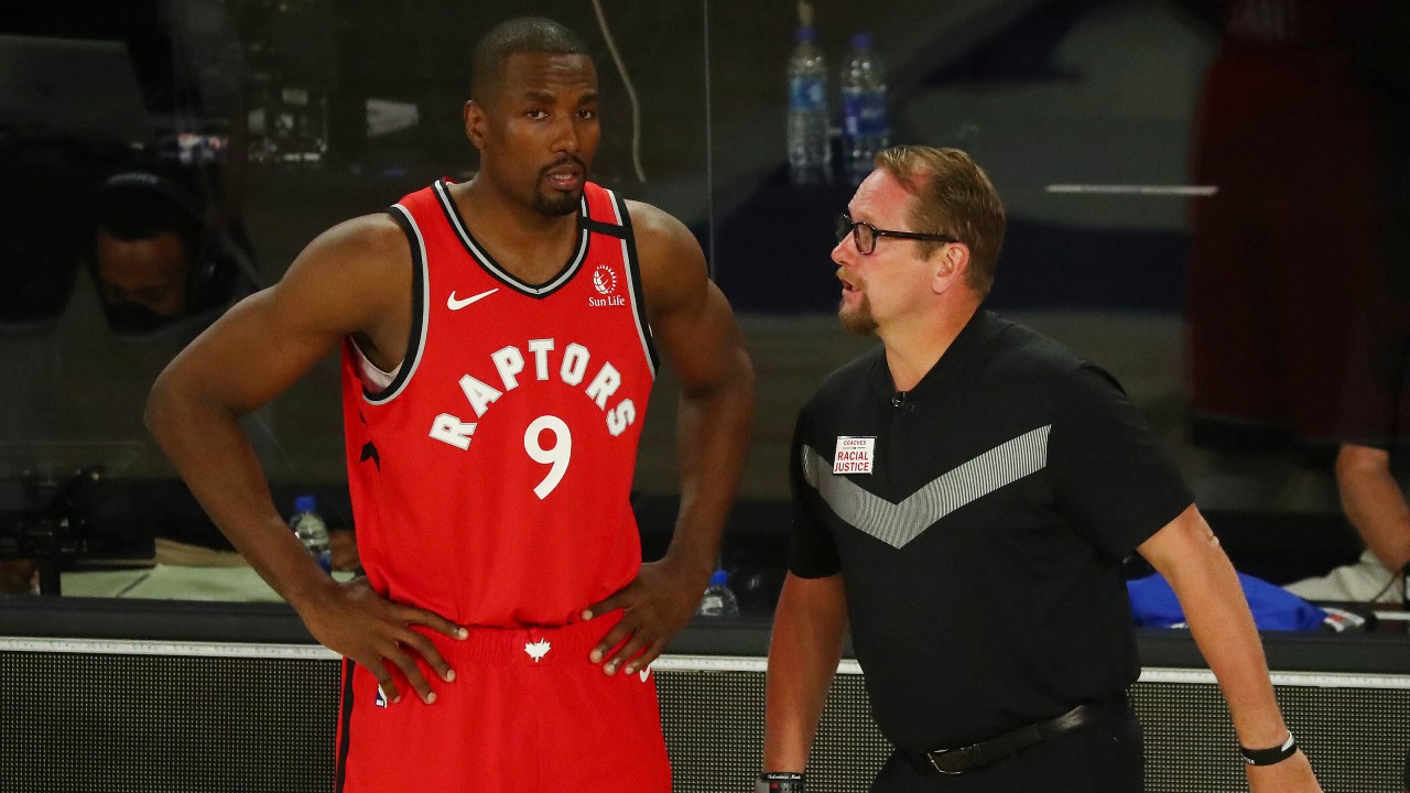 Toronto Raptors center Serge Ibaka (9) speaks with head coach Nick Nurse during a game against the Brooklyn Nets during the first half of Game 4 of an NBA basketball first-round playoff series. (Kim Klement/Pool Photo via AP)