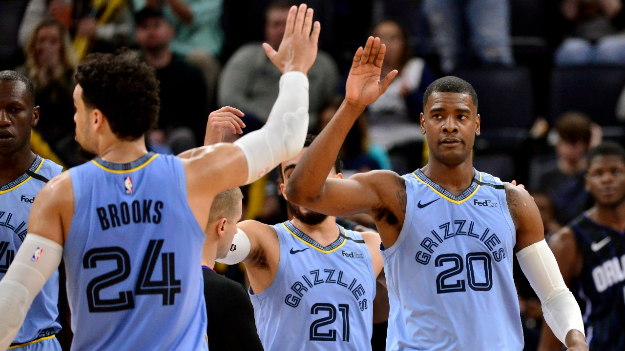 Memphis Grizzlies guard Josh Jackson (20) gets a high-five from guard Dillon Brooks (24) during the second half of the team's NBA basketball game against the Orlando Magic on Tuesday, March 10, 2020, in Memphis, Tenn. (Brandon Dill / AP)