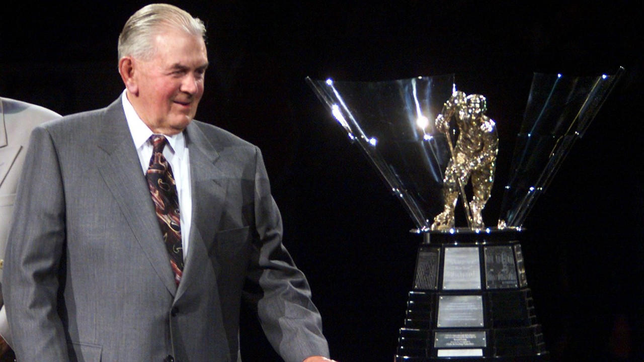 Montreal Canadiens superstar Maurice "Rocket" Richard unveils the new trophy named in his honour, given annually to the player who scores the most goals in a season. (CP PHOTO)