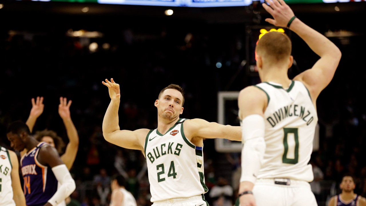 Milwaukee Bucks' Pat Connaughton (24) reacts with Donte DiVincenzo after DiVencenzo's three-point basket during the second half of an NBA basketball game against the Phoenix Suns, Sunday, Feb. 2, 2020, in Milwaukee. (Jeffrey Phelps / AP)