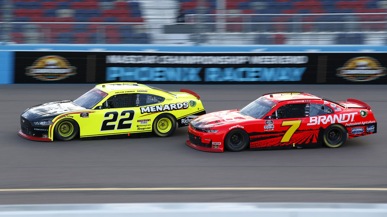 Austin Cindric (22) and Justin Allgaier (7) race for the lead through Turn 4 during a NASCAR Xfinity Series auto race at Phoenix Raceway. (Ralph Freso/AP)