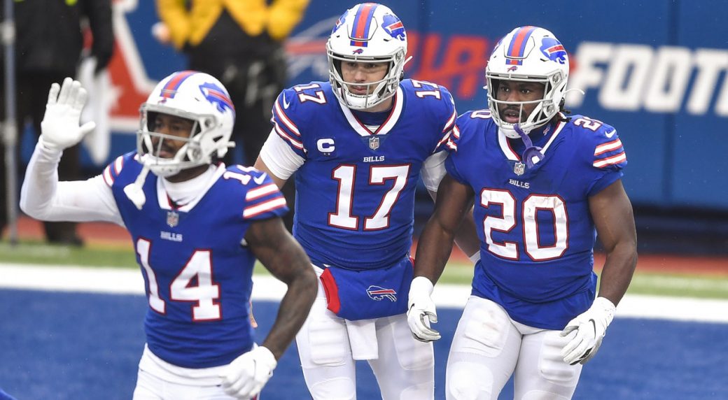 Buffalo Bills defensive tackle Justin Zimmer punches ball from New England  Patriots quarterback Cam Newton for game-winning Bills turnover