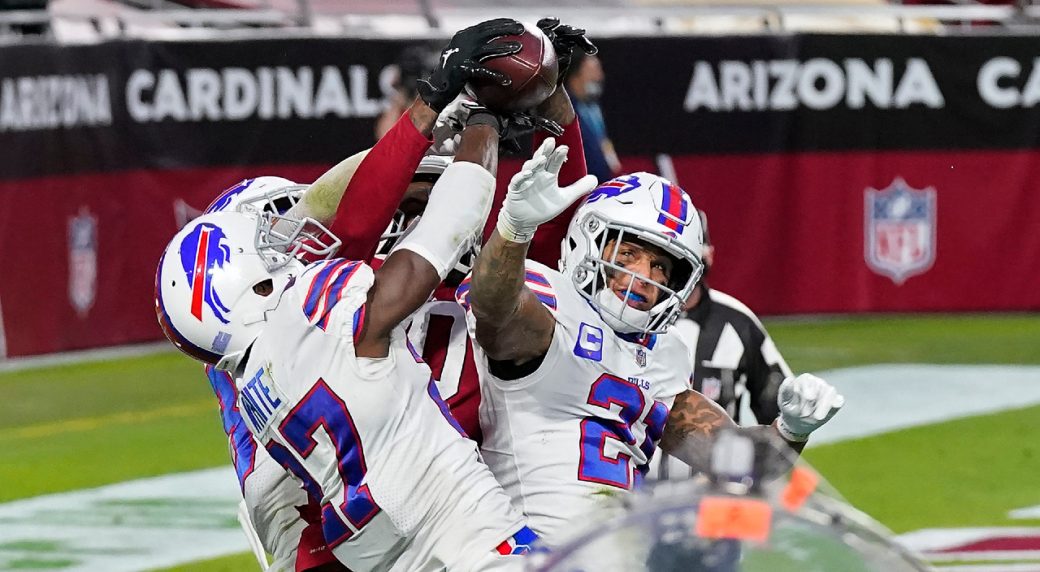 Tampa Bay Buccaneers safety Andrew Adams (26) grabs Buffalo Bills