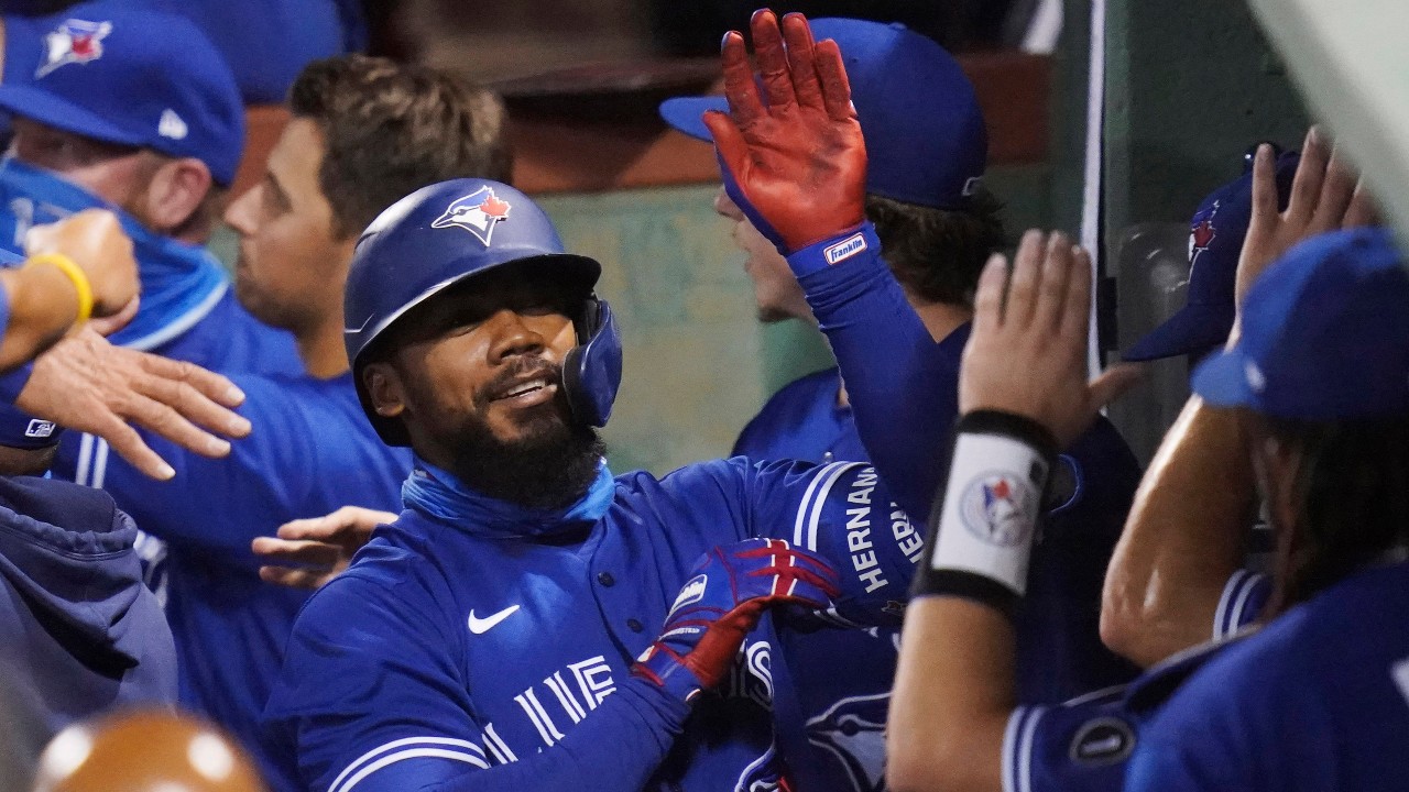 Toronto Blue Jays' Teoscar Hernandez is congratulated by teammates after his three-run home run, breaking a 2-2 tie, in 10th inning of a baseball game against the Boston Red Sox. (Charles Krupa/AP)