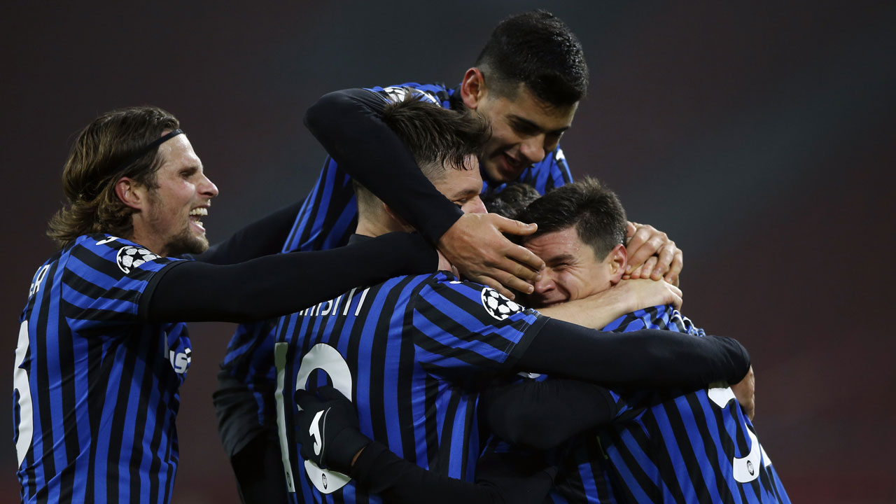 Atalanta's Luis Muriel celebrates with teammates after scoring his side's opening goal during the group D Champions League soccer match between Ajax and Atalanta. (Peter Dejong/AP)