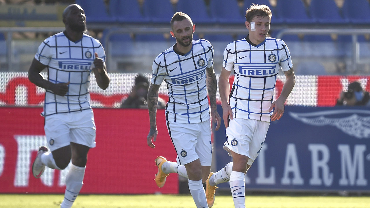 Inter's Nicolo' Barella, right, celebrates after scoring during the Italian Serie A soccer match between Cagliari and Inter Milan. (Alessandro Tocco/AP)