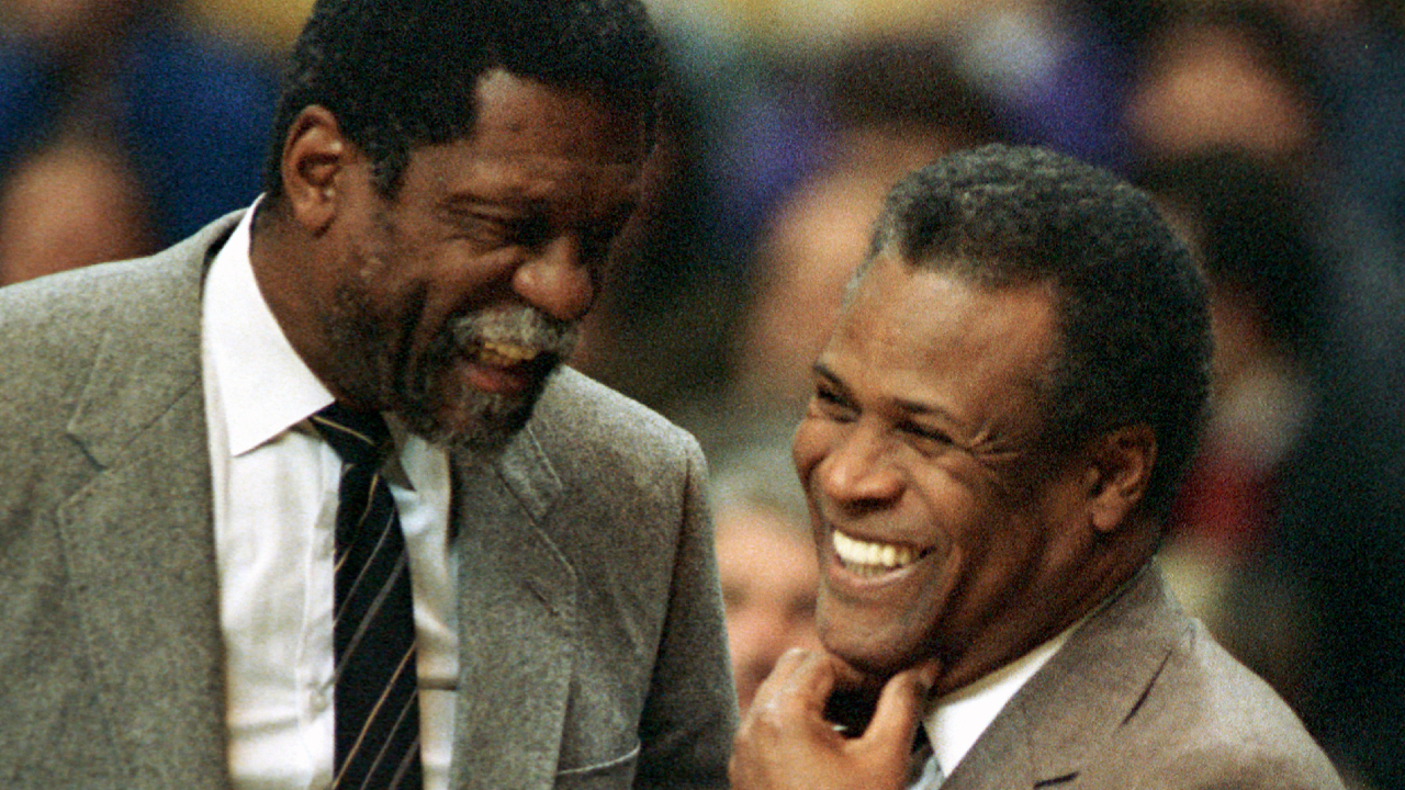 In this Jan. 15, 1988, file photo, former Boston Celtics teammates Bill Russell, Sacramento Kings coach, left, and K.C. Jones, Celtics coach, meet before the start of the Kings-Celtics NBA basketball game at the Boston Garden in Boston. Basketball Hall of Famer K.C. Jones, who won eight NBA championships as a Celtics player in the 1960s and two more as the coach of the Bostons team that took the titles in 1984 and '86, has died. He was 88. (Mike Kullen, File/AP)