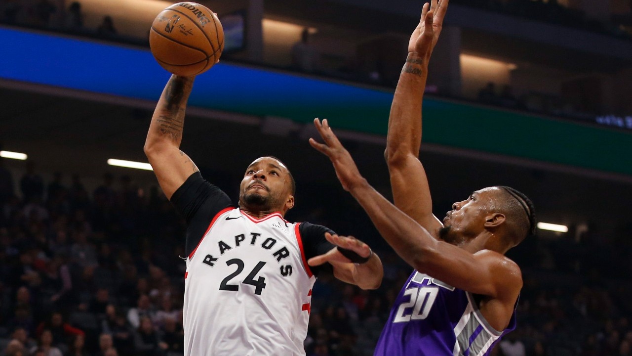 Toronto Raptors guard Norman Powell, left, goes to the basket. (Rich Pedroncelli/AP)