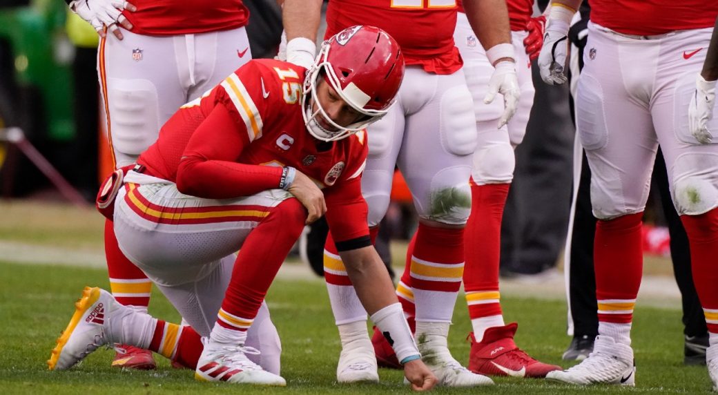 Kansas City Chiefs quarterback Patrick Mahomes walks off the field after an  NFL football game against