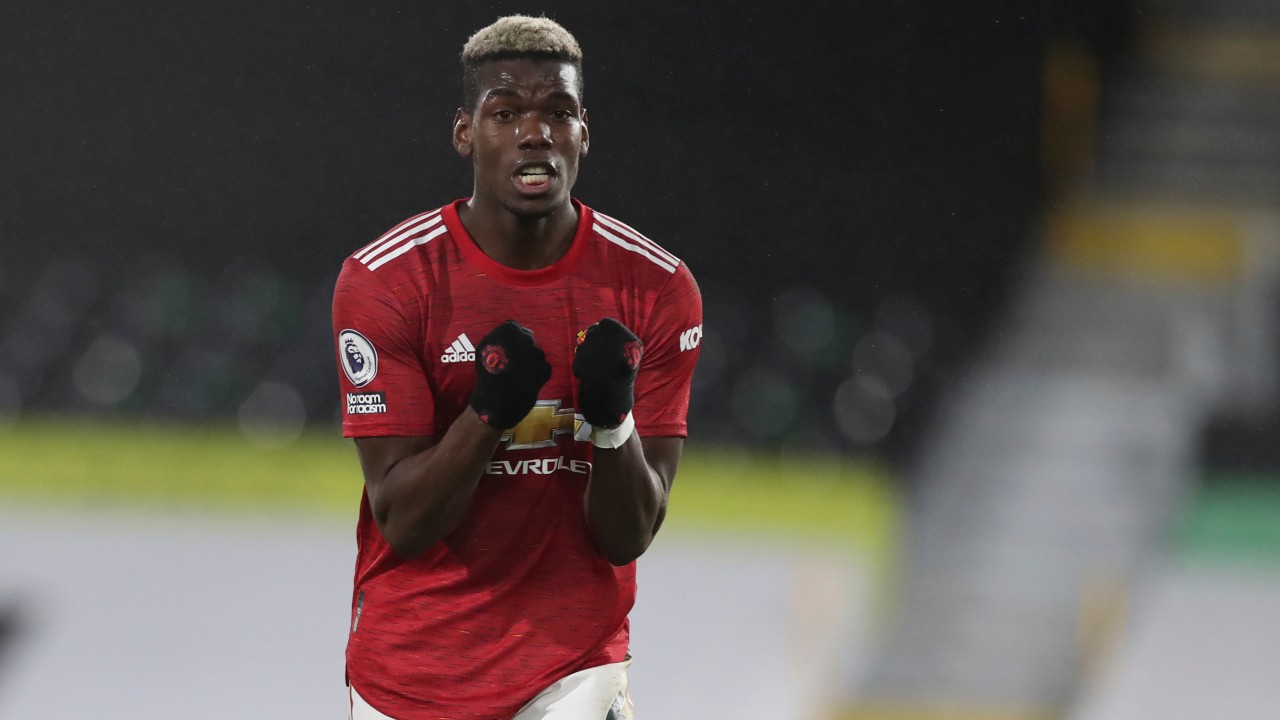 Manchester United's Paul Pogba celebrates at the end of the English Premier League soccer match between Fulham and Manchester United. (Peter Cziborra/Pool via AP) 