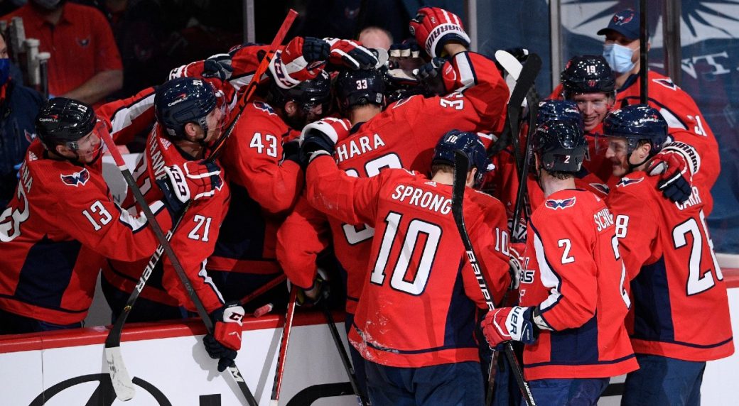 Capitals score five in second period to rally past Islanders