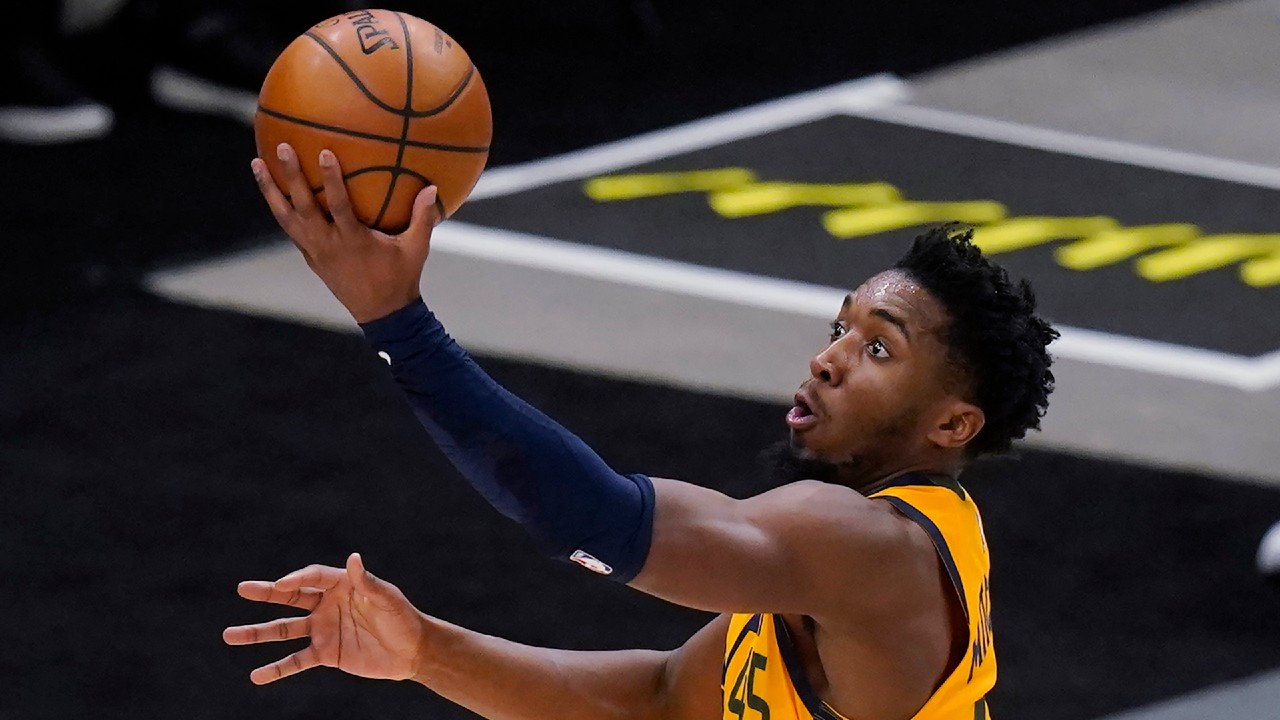 Utah Jazz guard Donovan Mitchell scores the ball. (Rick Bowmer/AP)