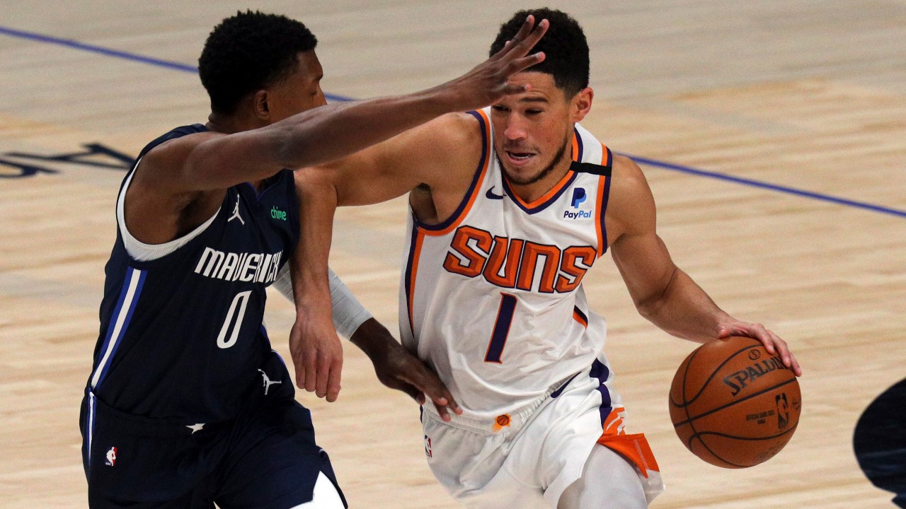 Dallas Mavericks guard Josh Richardson (0) defends against Phoenix Suns guard Devin Booker (1) in the first half during an NBA basketball game. (Richard W. Rodriguez/AP) 