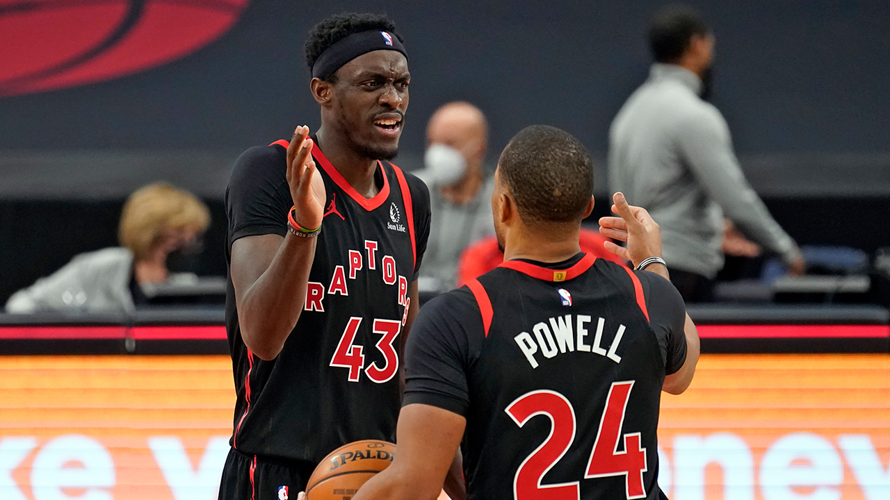 Toronto Raptors forward Pascal Siakam (43) celebrates with guard Norman Powell (24) after the team defeated the Philadelphia 76ers during an NBA basketball game Sunday, Feb. 21, 2021, in Tampa, Fla. (Chris O'Meara/AP)