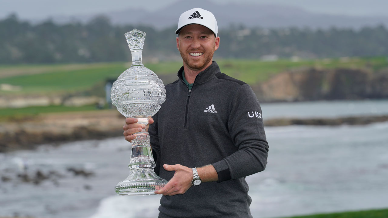 Daniel Berger poses with his trophy on the 18th green of the Pebble Beach Golf Links after winning the AT&T Pebble Beach Pro-Am. (Eric Risberg/AP)