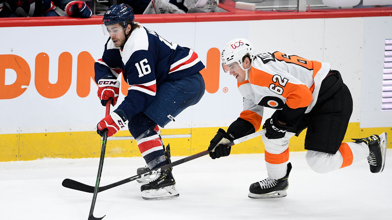 Washington Capitals centre Philippe Maillet and Philadelphia Flyers right wing Nicolas Aube-Kubel (62) battle for the puck. (Nick Wass/AP)