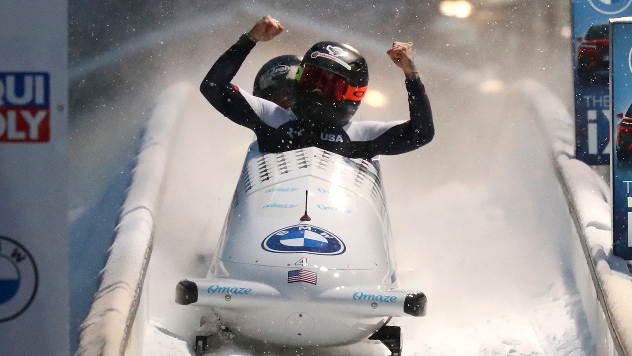 Kaillie Humphries and Lolo Jones of the United States celebrate after winning the two women's bobsleigh race at the Bobsleigh and Skeleton World Championships in Altenberg, Germany, Saturday, Feb. 6, 2021. (Matthias Schrader/AP)