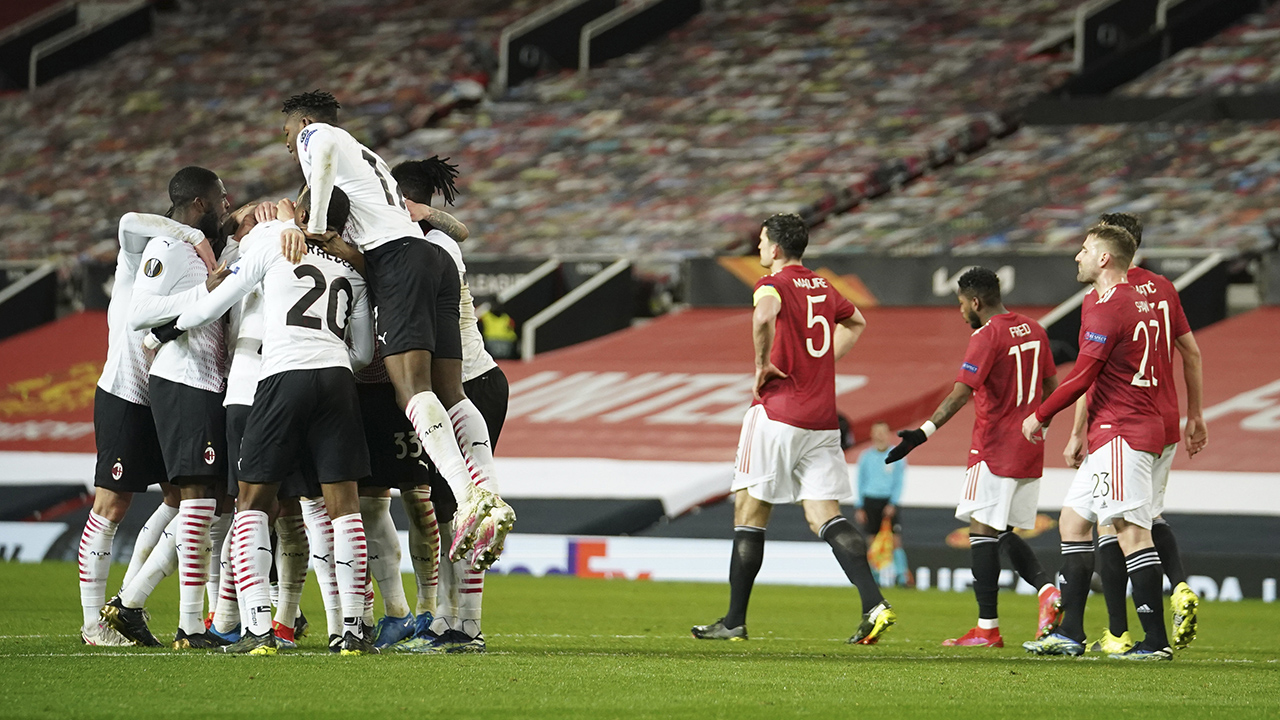 AC Milan players celebrate after AC Milan's Simon Kjaer scored his side's opening goal during the Europa League round of 16. (Dave Thompson/AP)