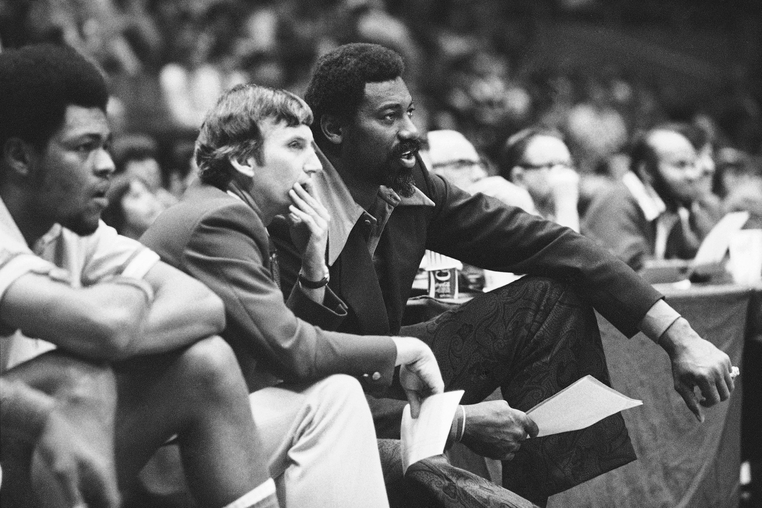 In this 1974 photo, Wilt Chamberlain, right, coach of the San Diego Conquistadors, and assistant coach Stan Albeck, middle, watch in the opening minutes of the team's basketball game. (Richard Drew/AP)