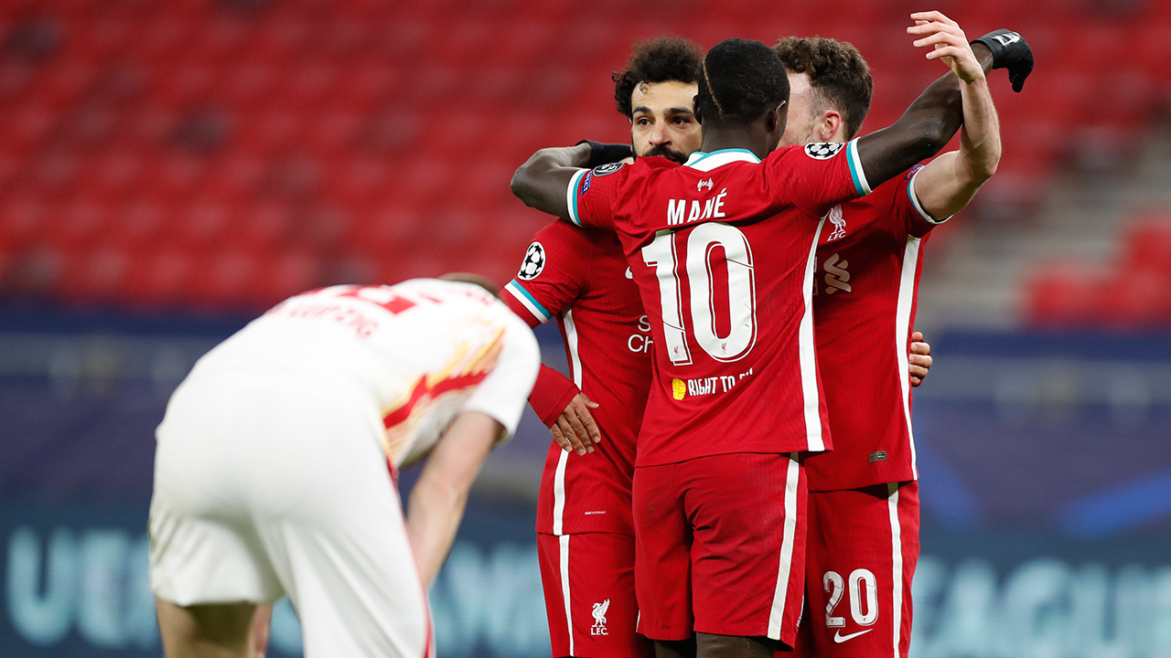 Liverpool's Mohamed Salah, centre, celebrates after scoring his side's opening goal during the Champions League round of 16 second leg match between Liverpool and RB Leipzig at the Puskas Arena stadium in Budapest, Hungary, Wednesday, March 10, 2021. (Laszlo Balogh/AP)