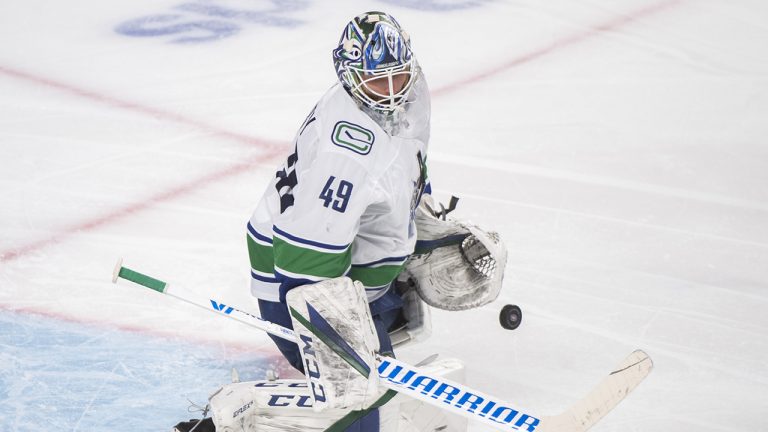 Vancouver Canucks goaltender Braden Holtby makes a save during an NHL hockey game. (Graham Hughes/CP)