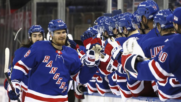 New York Rangers' Pavel Buchnevich, left, is greeted at the bench after scoring a goal. (Bruce Bennett/AP)