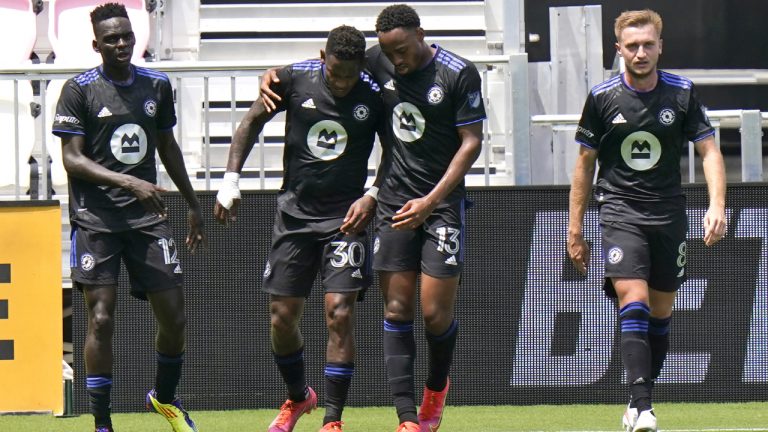 CF Montreal forward Romell Quioto (30) is congratulated by forward Mason Toye (13) after scoring a goal during the first half of an MLS soccer match against Toronto FC. (Lynne Sladky/AP)