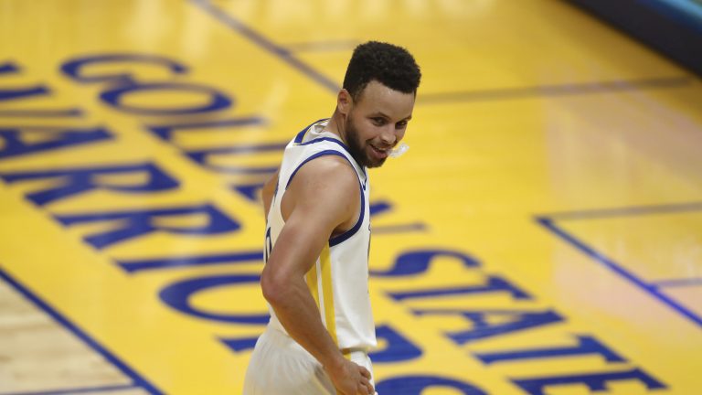 Golden State Warriors guard Steph Curry looks on during the first half of an NBA basketball game against the Chicago Bulls in San Francisco, Monday, March 29, 2021. (AP Photo/Jed Jacobsohn)