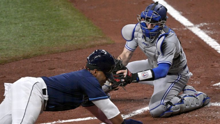 Tampa Bay Rays' Yandy Diaz is tagged out at home plate by Toronto Blue Jays catcher Danny Jansen during the first inning of a baseball game Friday, April 23, 2021, in St. Petersburg, Fla. (Phelan M. Ebenhack/AP)