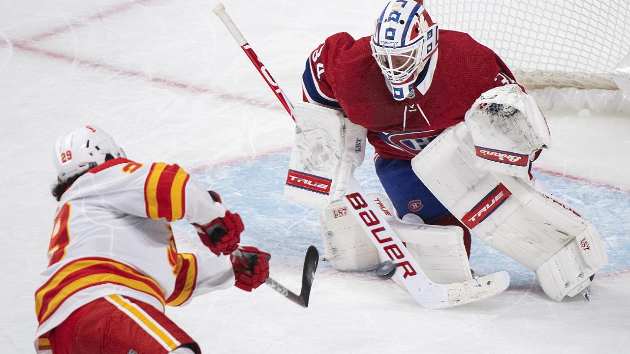 Calgary Flames' Dillon Dube moves in on Montreal Canadiens goaltender Jake Allen during third period NHL hockey action in Montreal, Saturday, January 30, 2021.THE CANADIAN PRESS/Graham Hughes