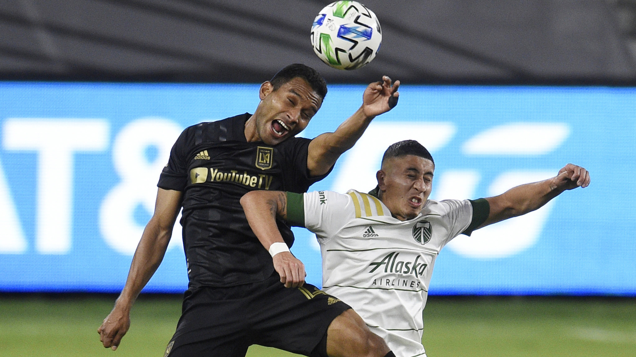 Los Angeles FC defender Eddie Segura, left, and Portland Timbers midfielder Marvin Loría battle for the header. (Kelvin Kuo/AP)