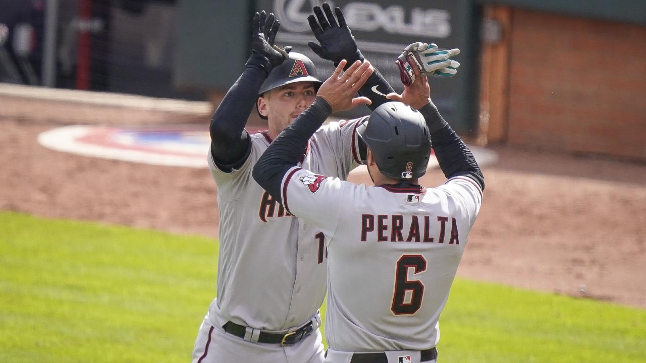 Arizona Diamondbacks' David Peralta (6) talks with Diamondbacks