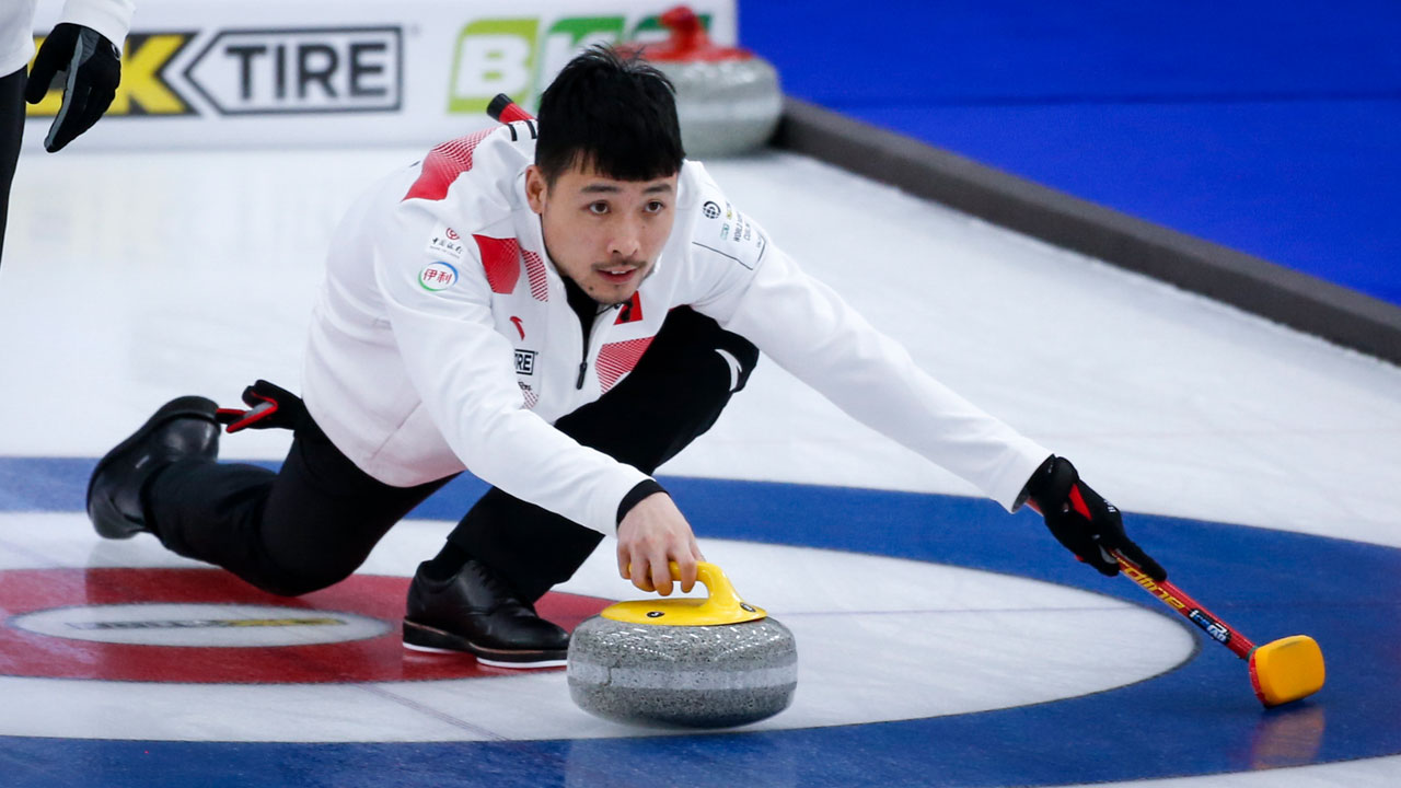 China skip Qiang Zou makes a shot against Sweden at the Men's World Curling Championships in Calgary. (Jeff McIntosh/CP)