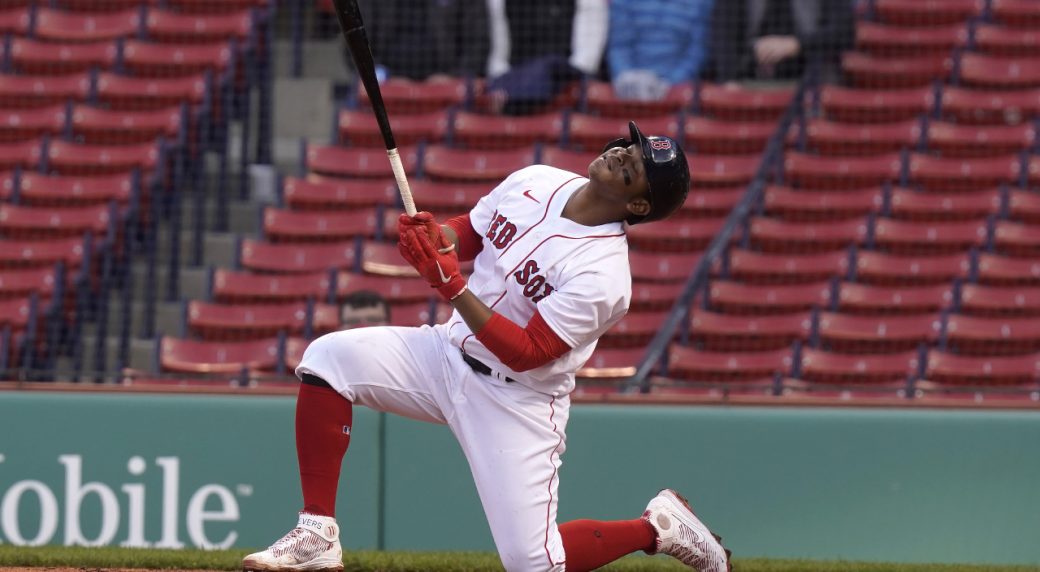 Rafael Devers of the Boston Red Sox reacts after hitting a single