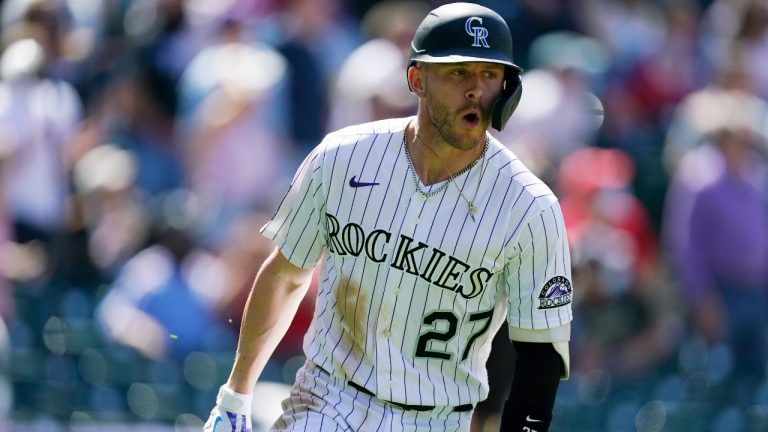 Colorado Rockies' Trevor Story circles the bases after hitting a grand slam off Philadelphia Phillies relief pitcher David Hale in the fourth inning of a baseball game Sunday, April 25, 2021, in Denver. (David Zalubowski / AP)