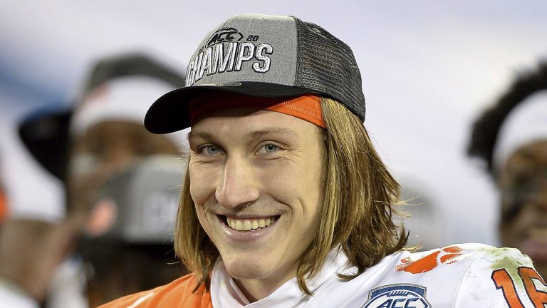 Clemson quarterback Trevor Lawrence smiles after defeating Notre Dame in the Atlantic Coast Conference championship NCAA college football game. (Jeff Siner/The News Observer via AP, File)