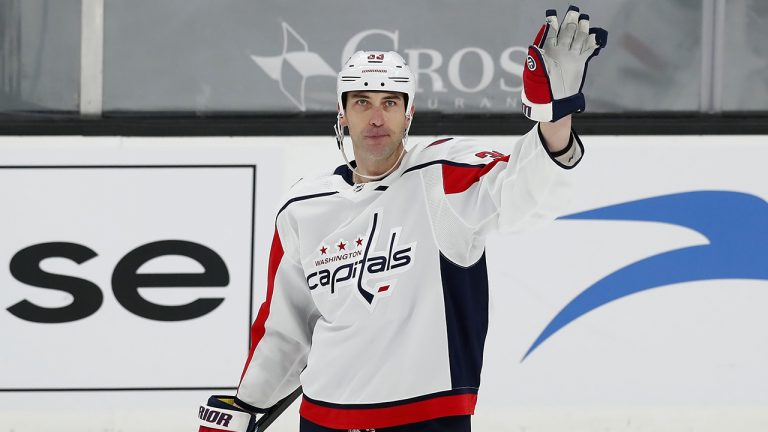 Washington Capitals' Zdeno Chara waves to the crowd after a video tribute during the first period of an NHL hockey game against his former team the Boston Bruins, Sunday, April 11, 2021, in Boston. (Michael Dwyer/AP)