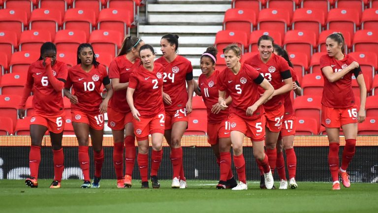 Canadian players celebrate a goal against England during the women's international friendly soccer match between England and Canada at Bet365 stadium in Stoke on Trent, England, Tuesday, April 13, 2021. (Rui Vieira/AP)