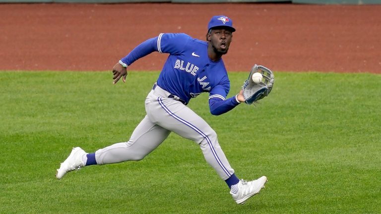 Toronto Blue Jays center fielder Jonathan Davis catches a fly ball for the out on Kansas City Royals' Whit Merrifield during the sixth inning in the first baseball game of a doubleheader, Saturday, April 17, 2021, in Kansas City, Mo. (Charlie Riedel/AP)