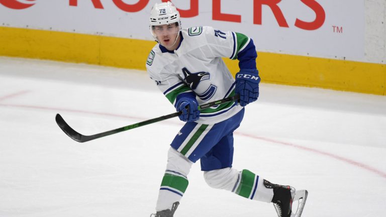 Vancouver Canucks forward Kole Lind (78) shoots the puck against Toronto Maple Leafs. (Dan Hamilton/USA Today)