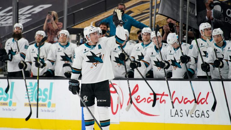 San Jose Sharks center Patrick Marleau (12) waves to the crowd during a small ceremony to mark his passing Gordie Howe for most NHL games played in the first period of an NHL hockey game. (John Locher/AP)